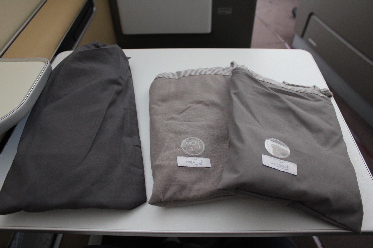 a group of grey bags on a table
