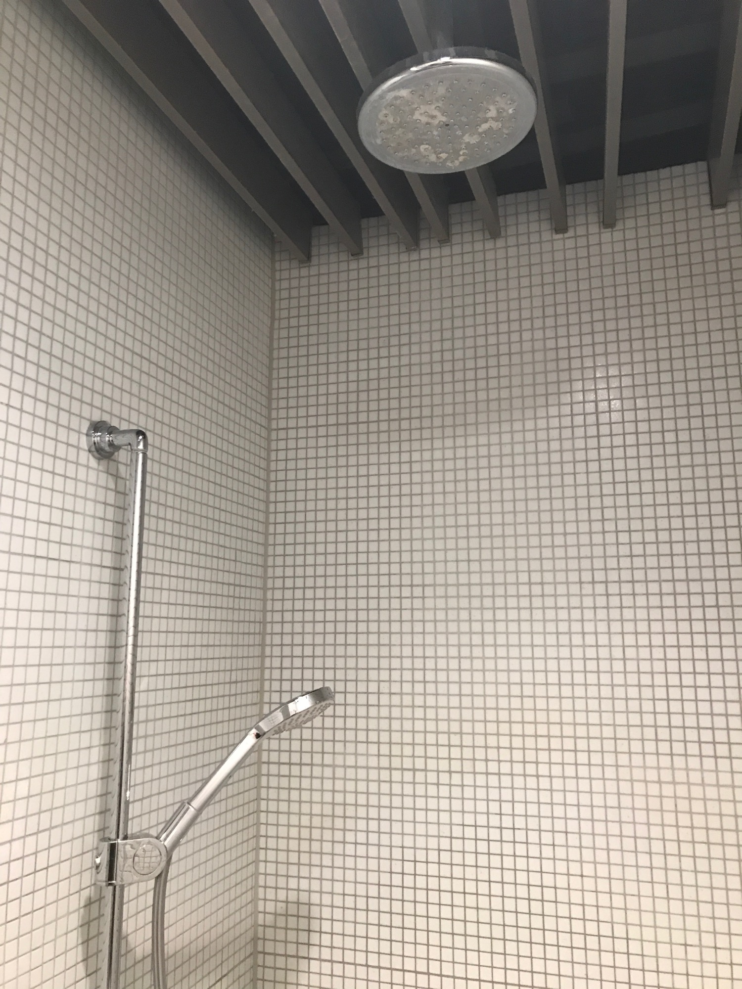 a shower head in a bathroom