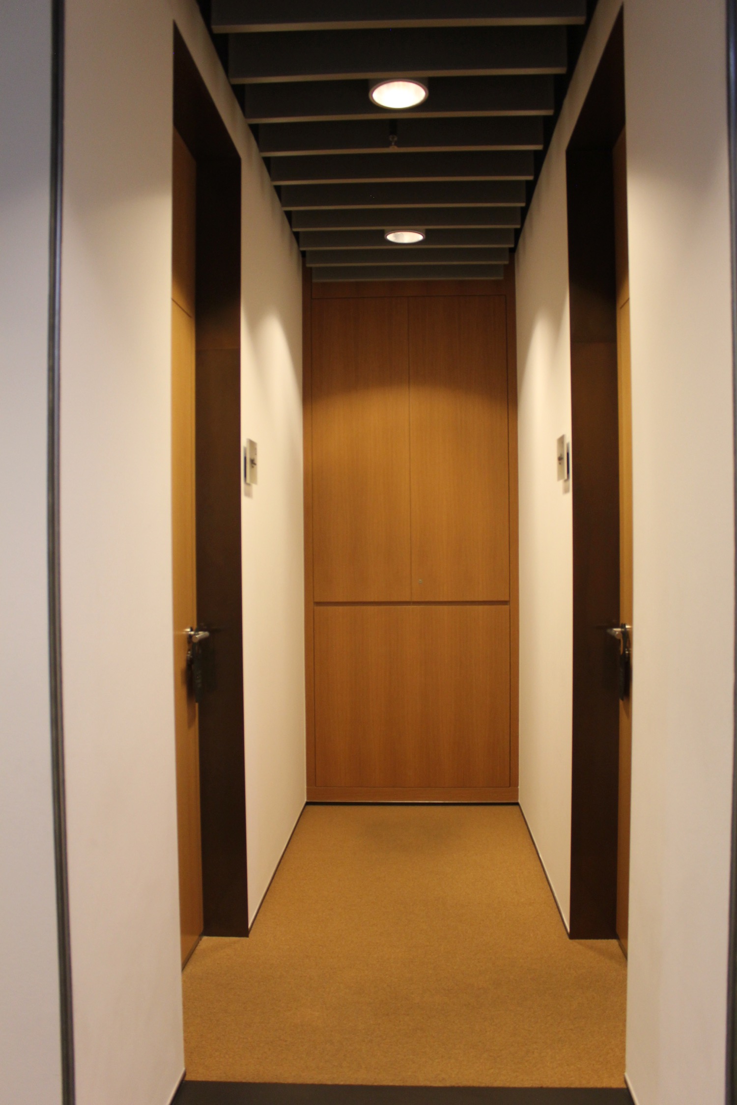 a hallway with two doors