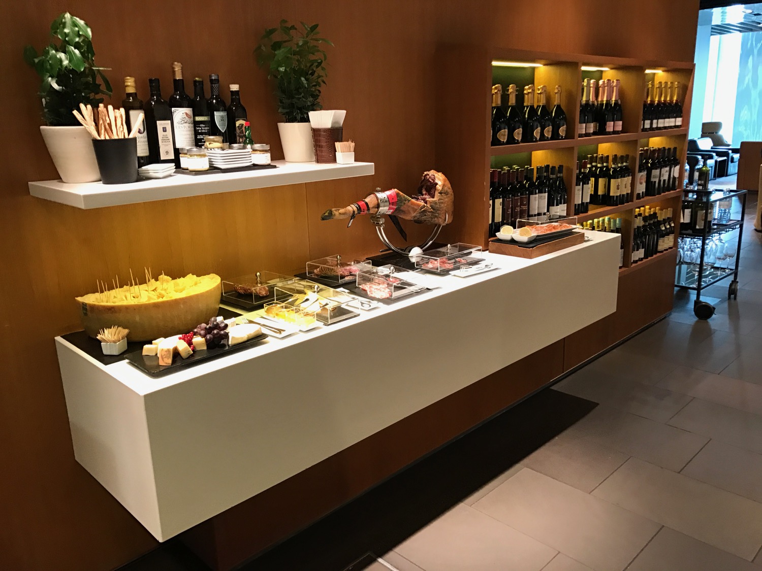 a display of wine bottles and snacks