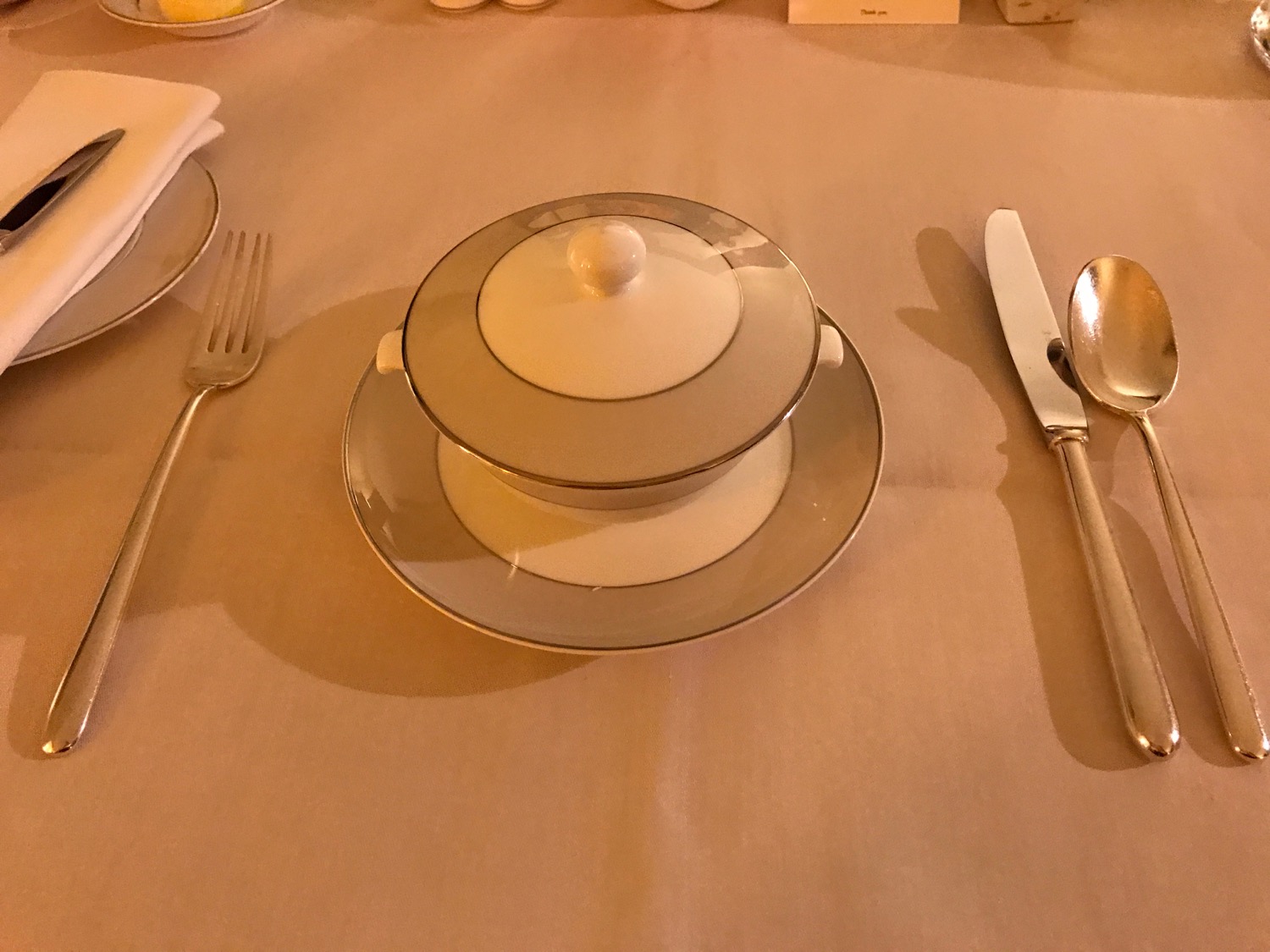 a table with a plate and a bowl on it