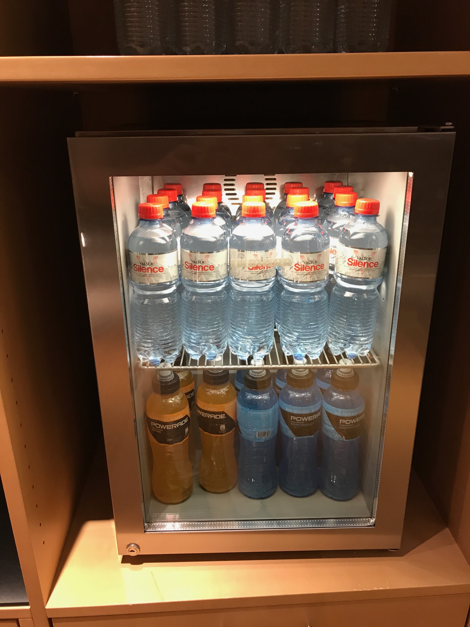 a refrigerator with bottles of water