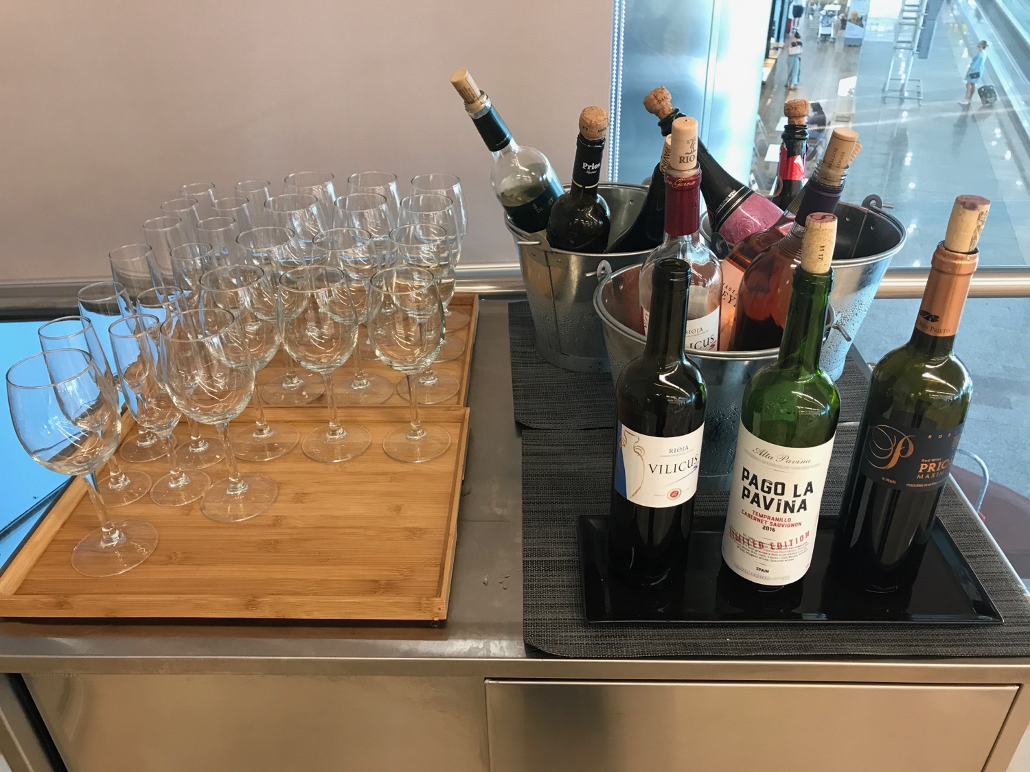a group of wine bottles and wine glasses on a table
