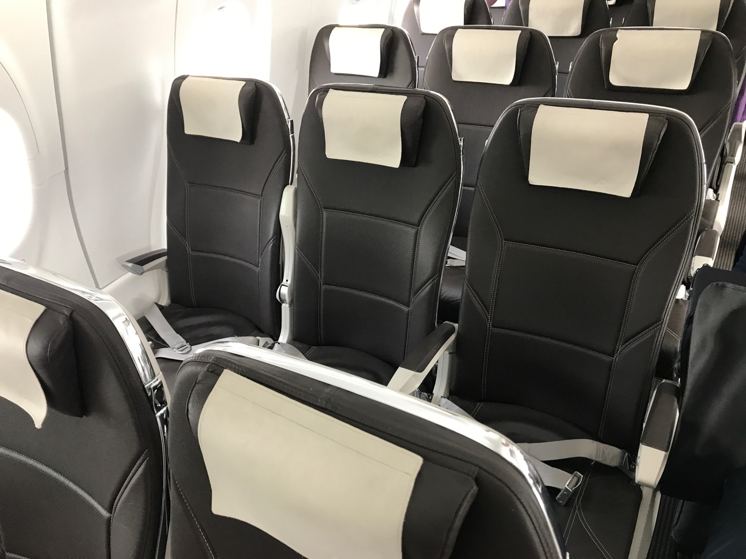 a row of black and white seats