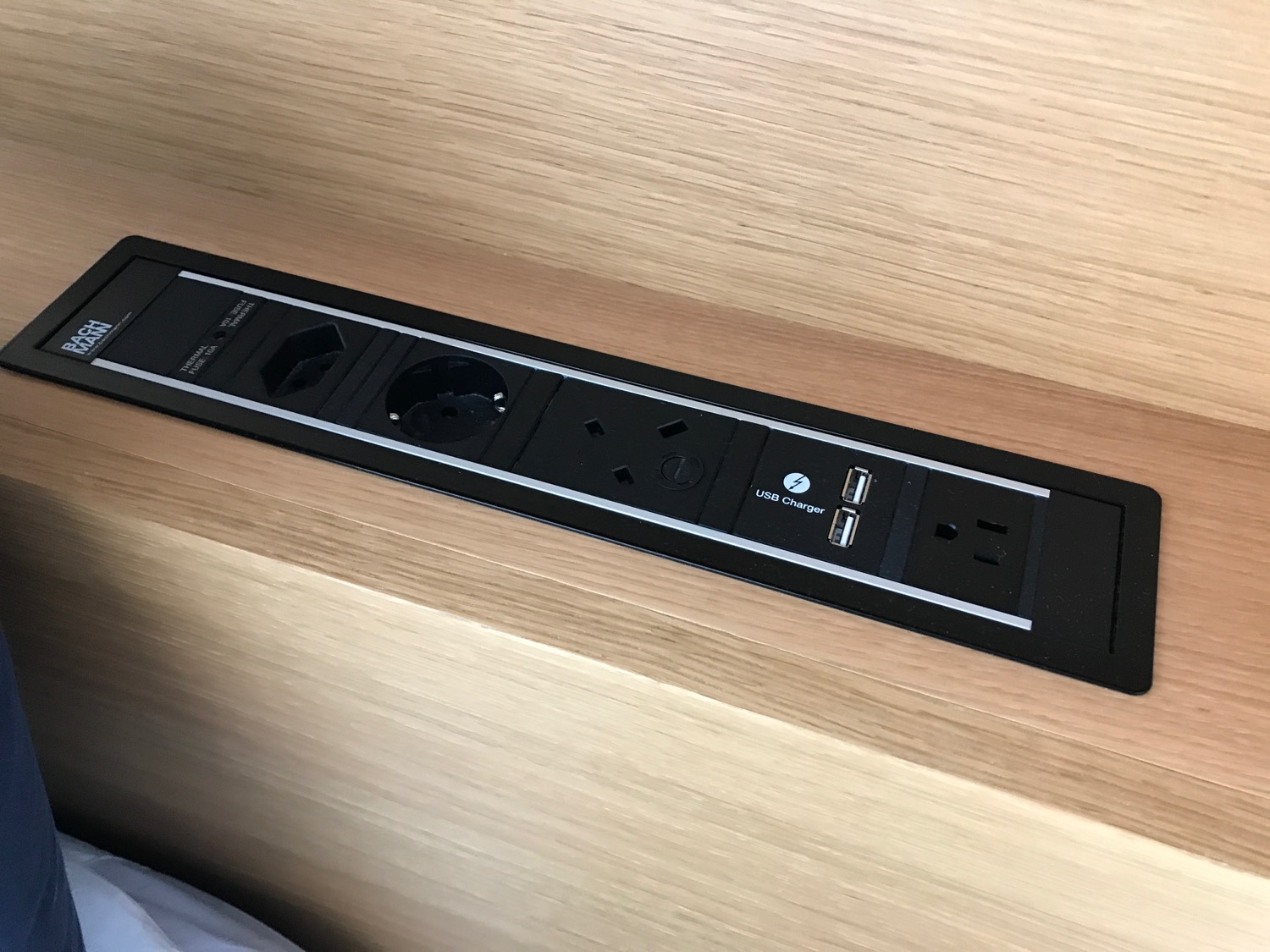 a black power strip with multiple outlets