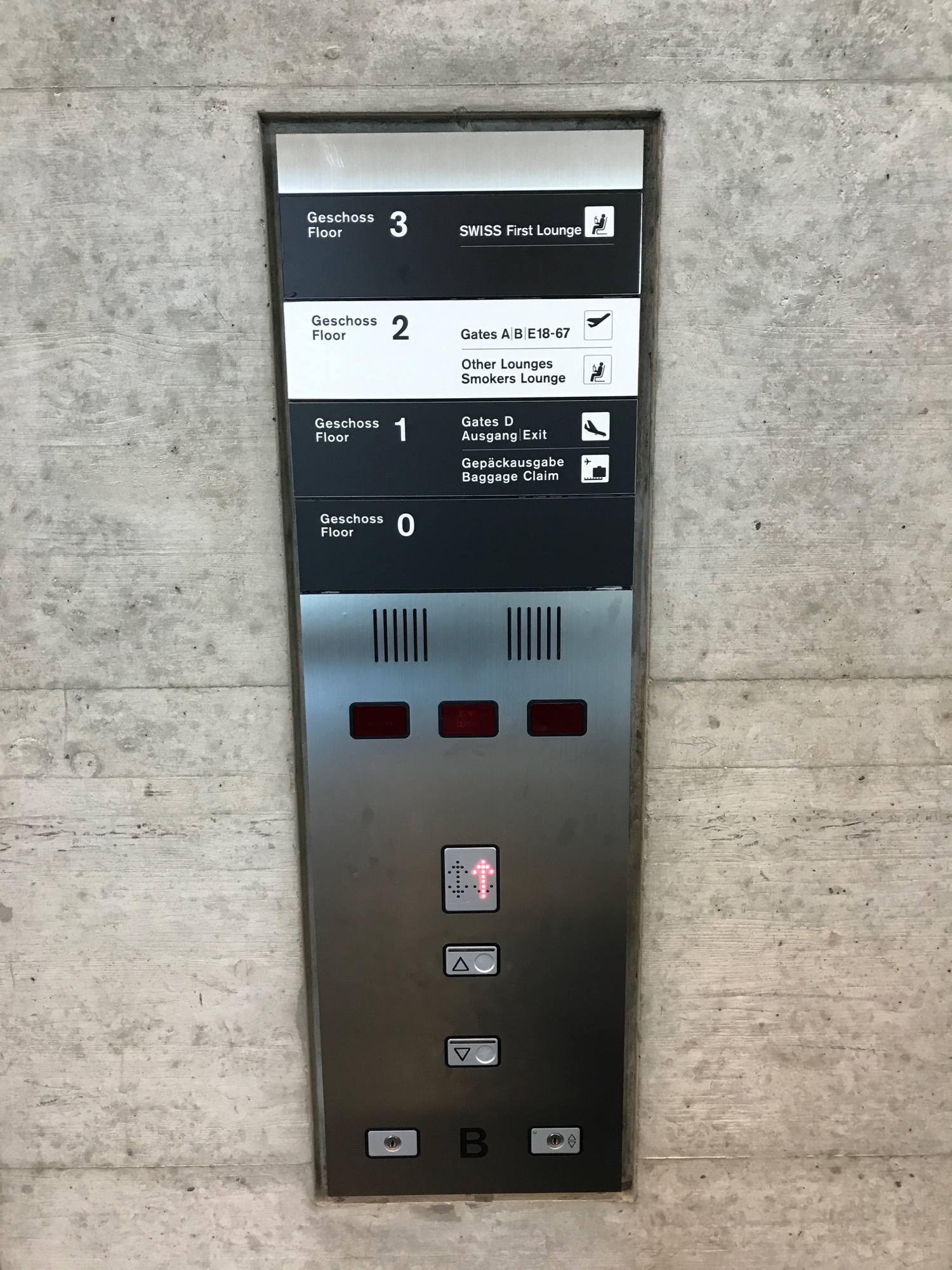 a metal panel with buttons and buttons on the side