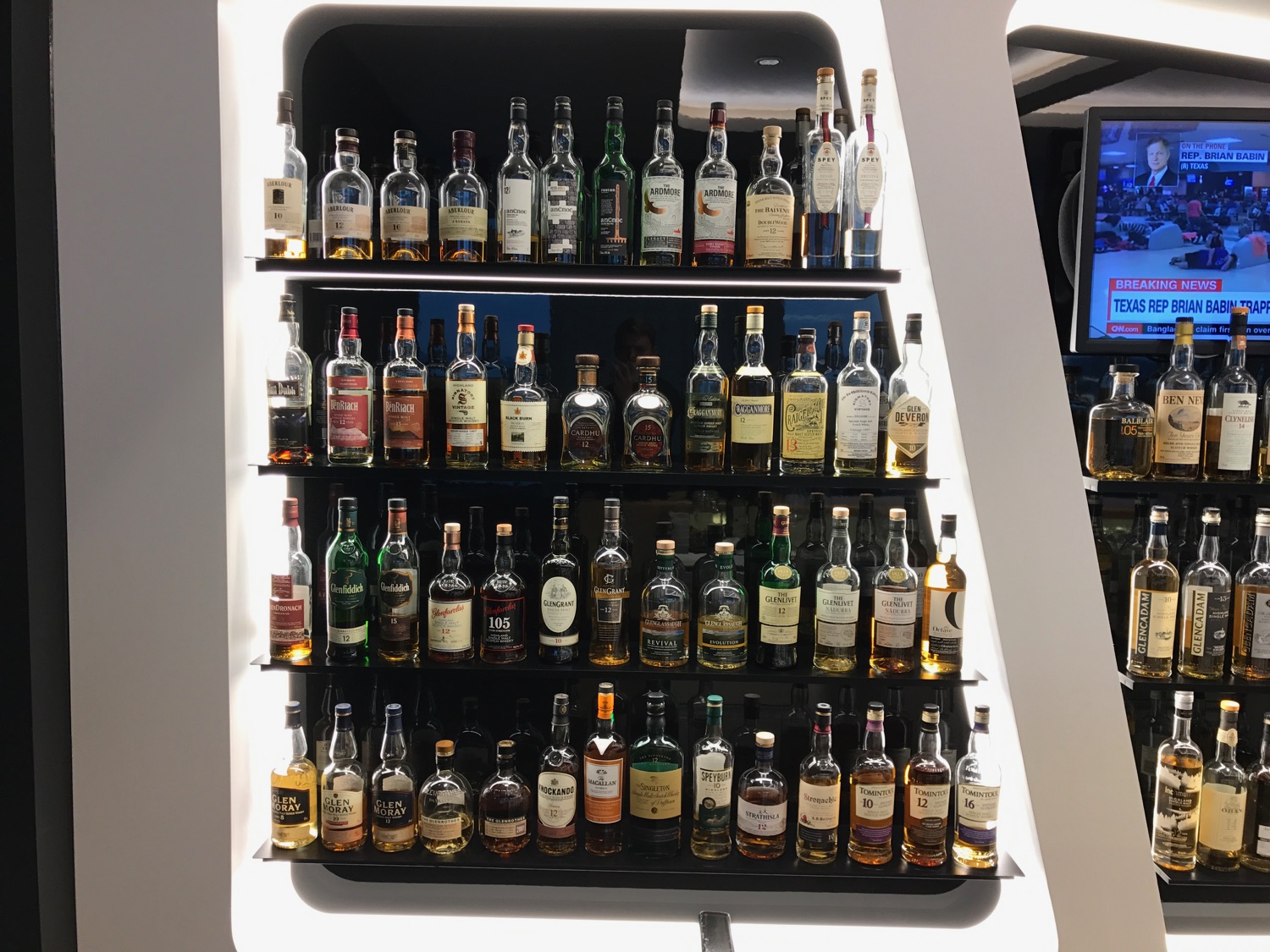 a shelf of liquor bottles