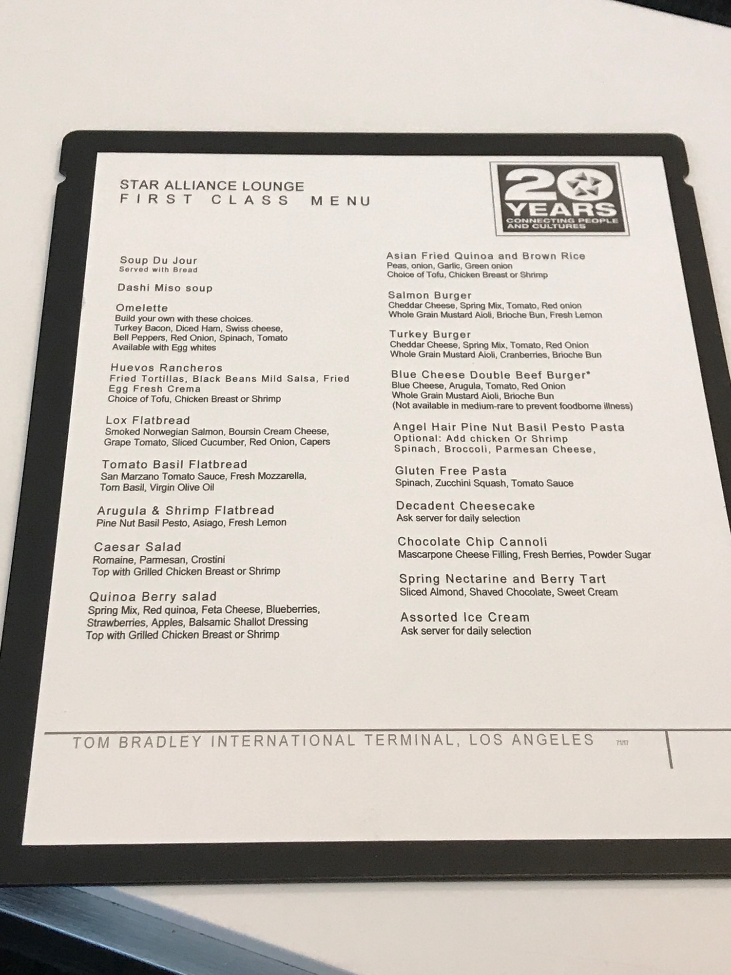 a menu with black text on a white surface