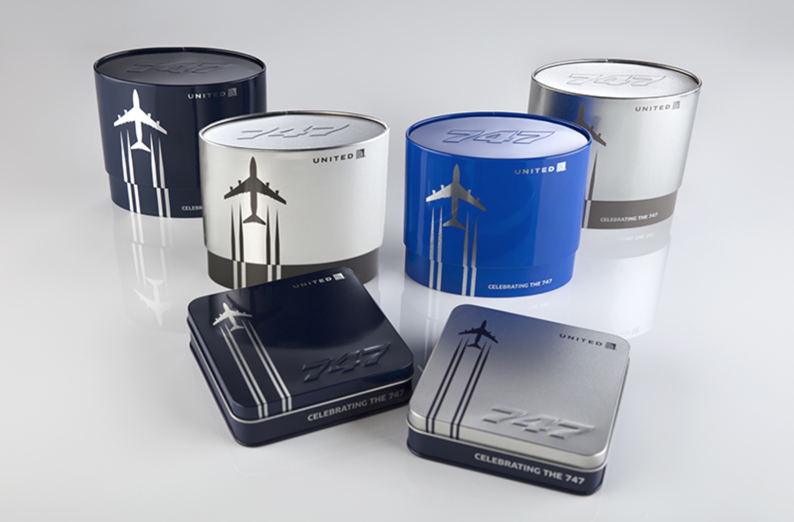 a group of metal containers with airplanes on them