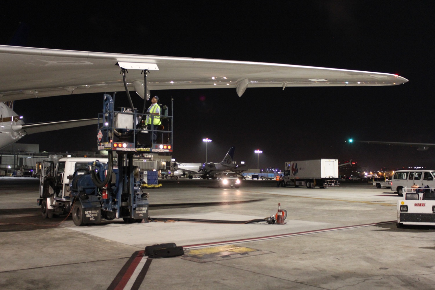 a man standing on a platform next to an airplane