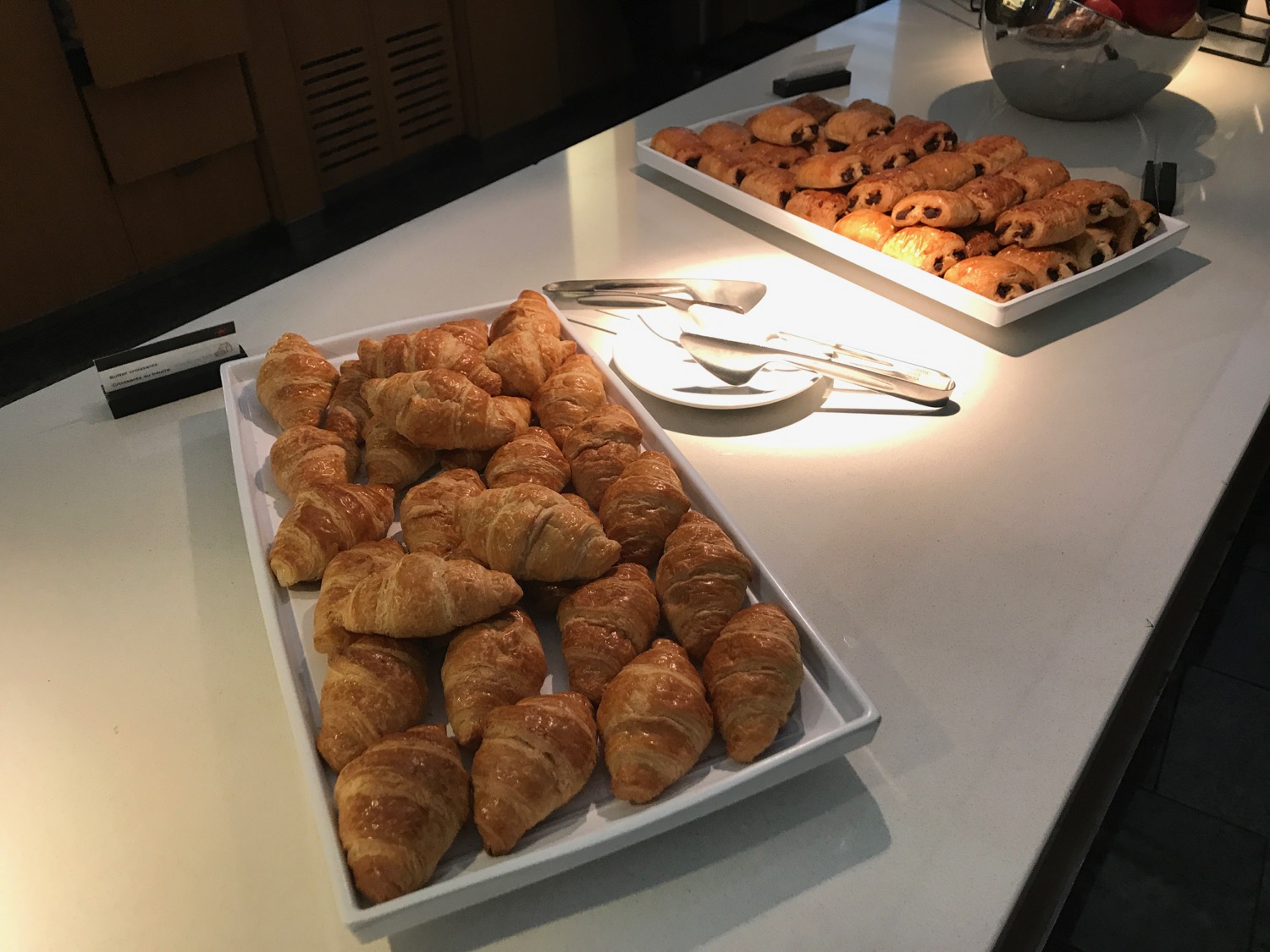 a trays of croissants on a table