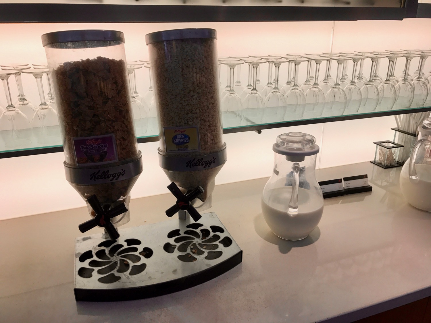 a group of cereal dispensers on a counter