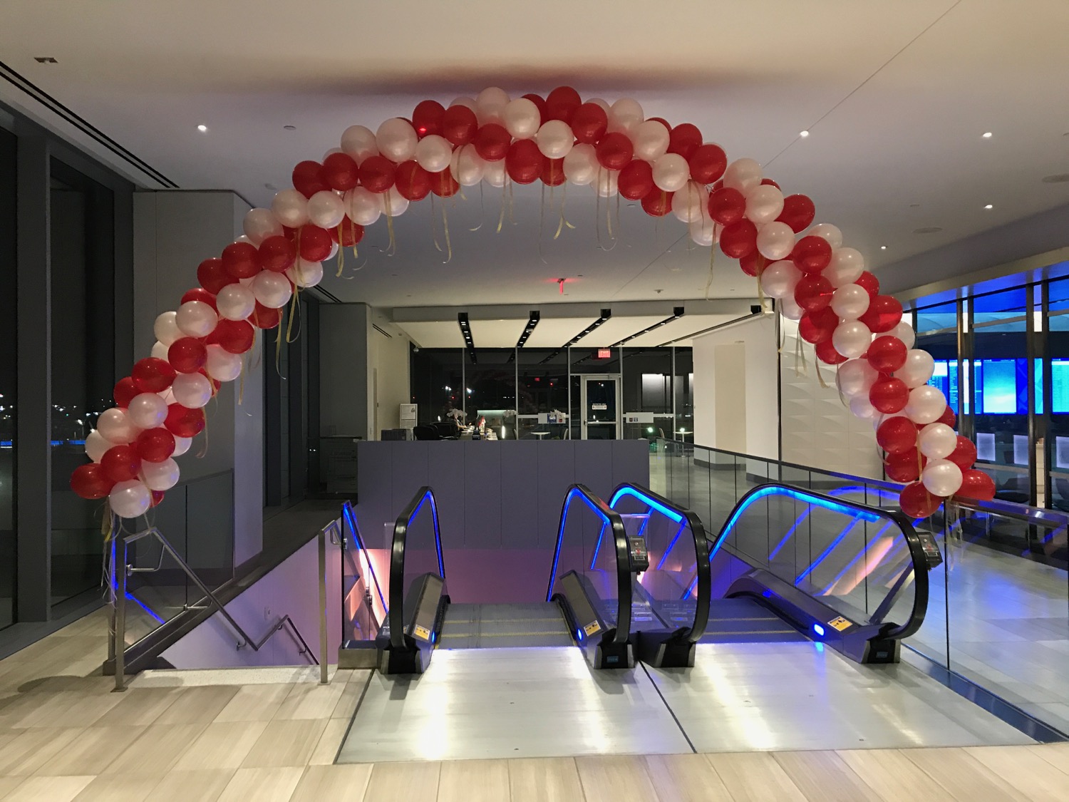 a red and white balloon arch
