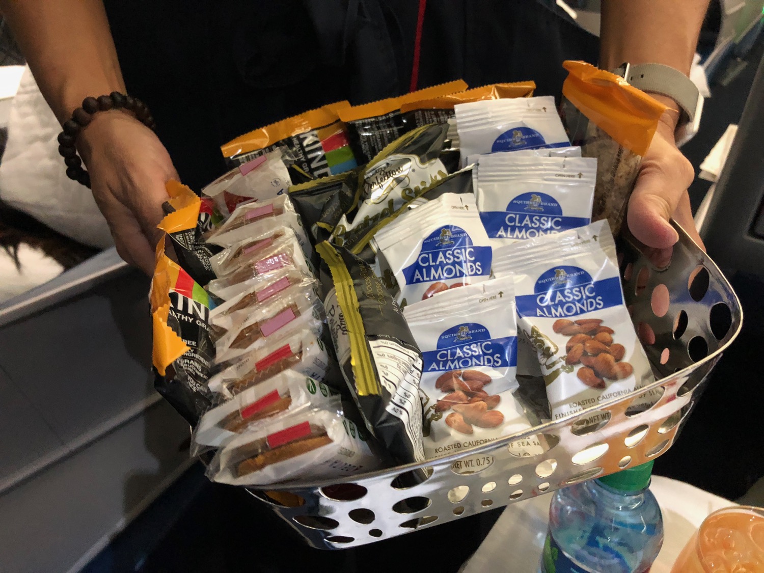 a basket of food in a person's hands