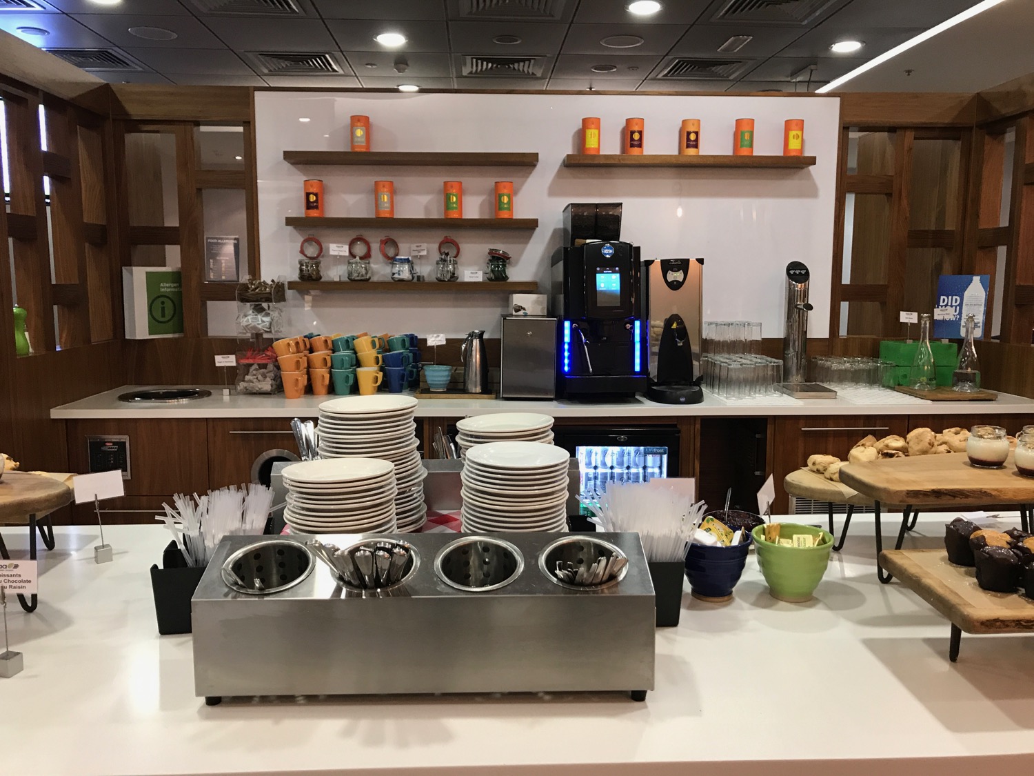 a coffee machine and plates on a counter