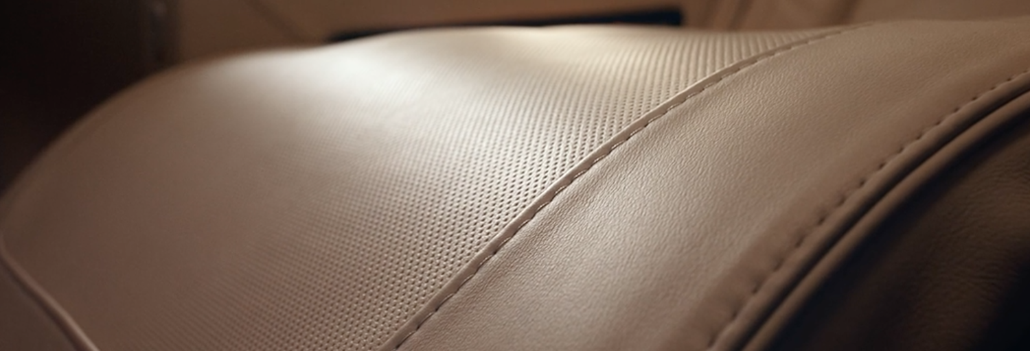 a close up of a white leather seat