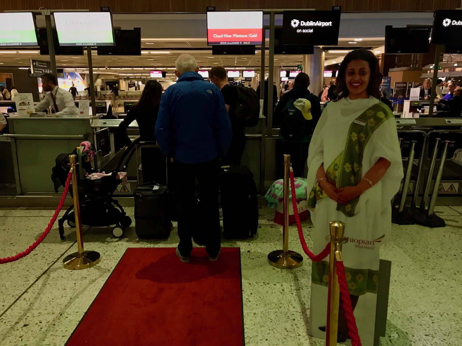 a woman standing in front of a red carpet