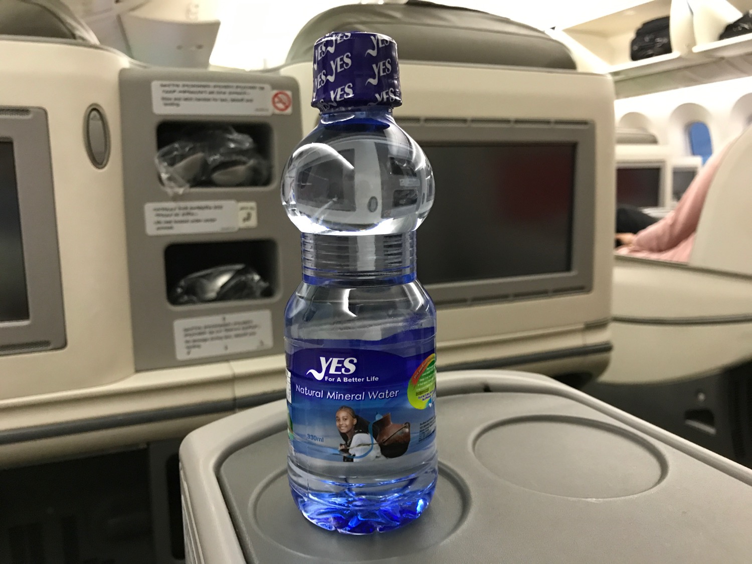 a bottle of water on a tray