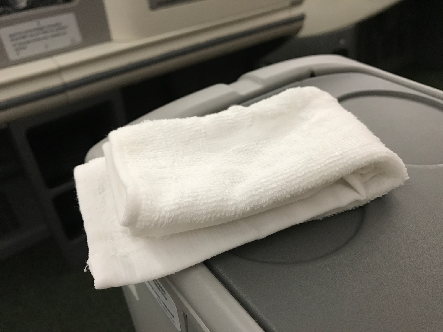 a white towel on a grey surface