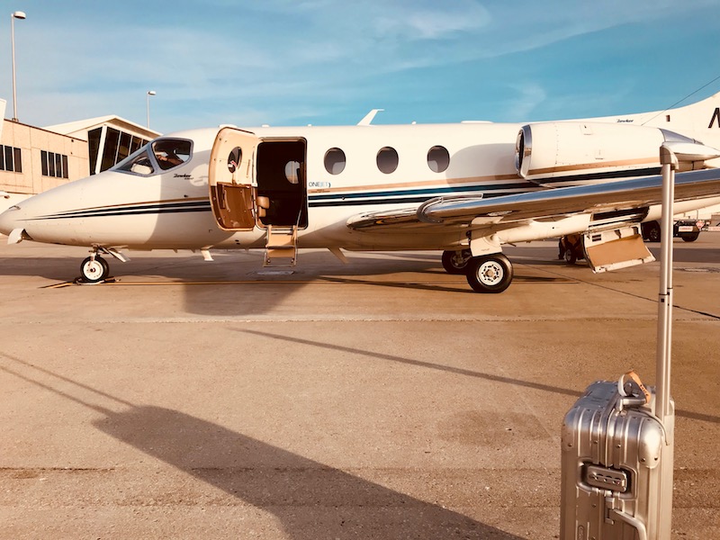My Rimowa and OneJet's Hawker 400 on the tarmac in Pittsburgh.