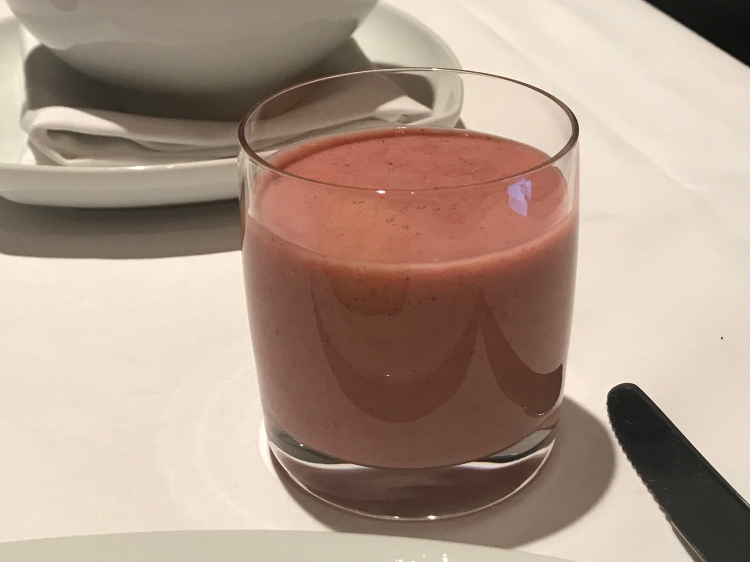 a glass of pink smoothie