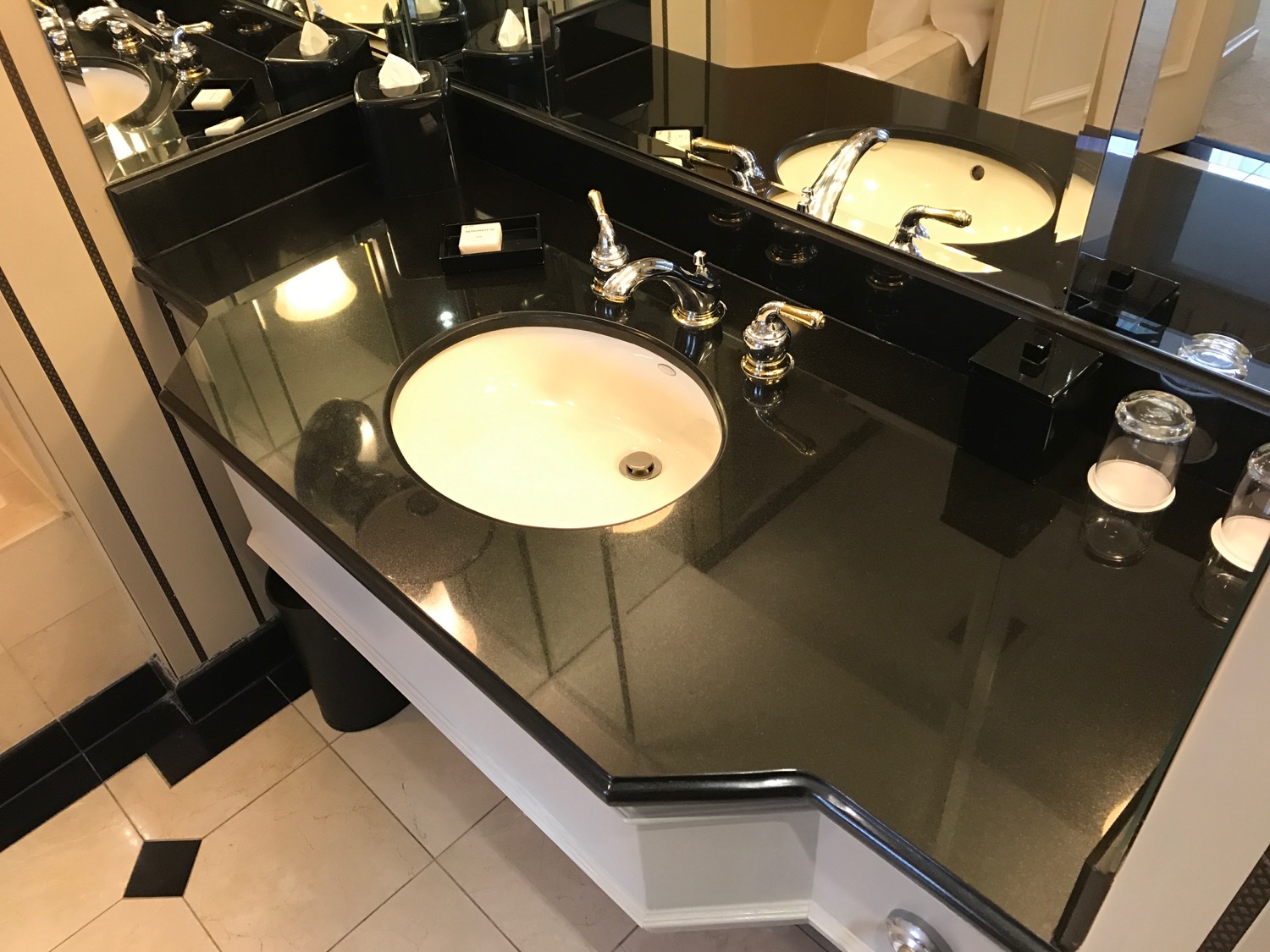 a bathroom with a black countertop
