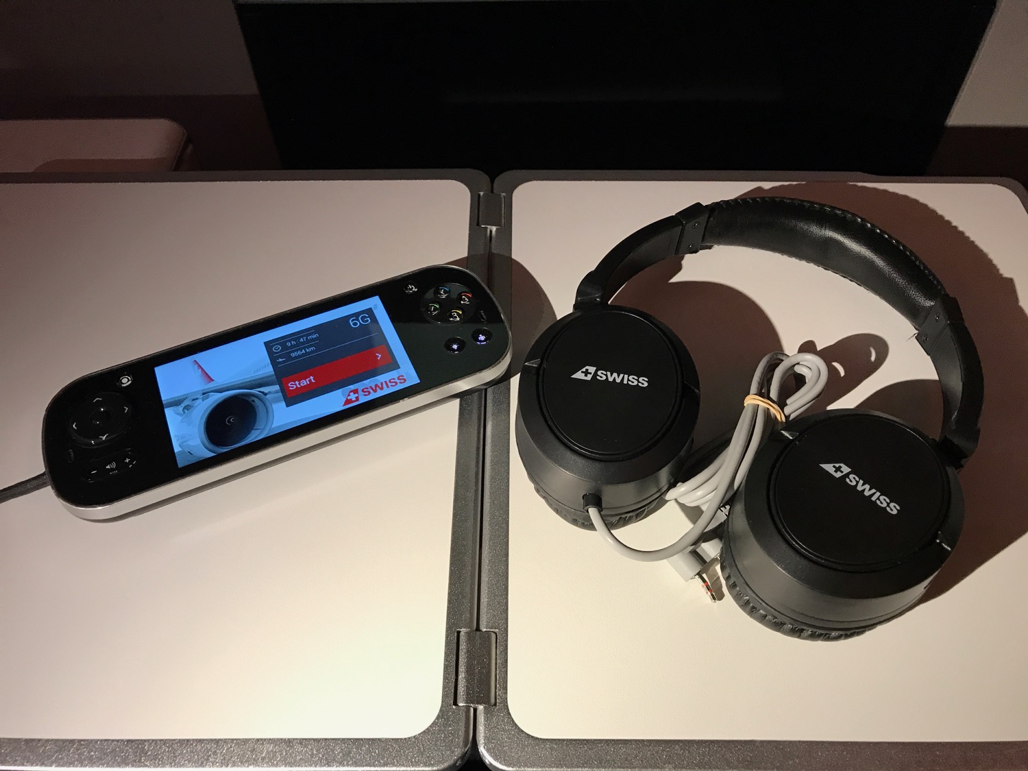 a device and headphones on a table