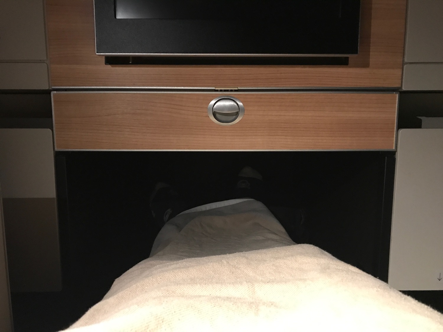 a person's leg under a tv