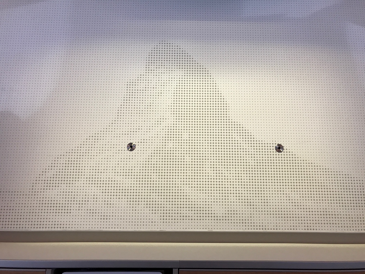 a white board with holes in it