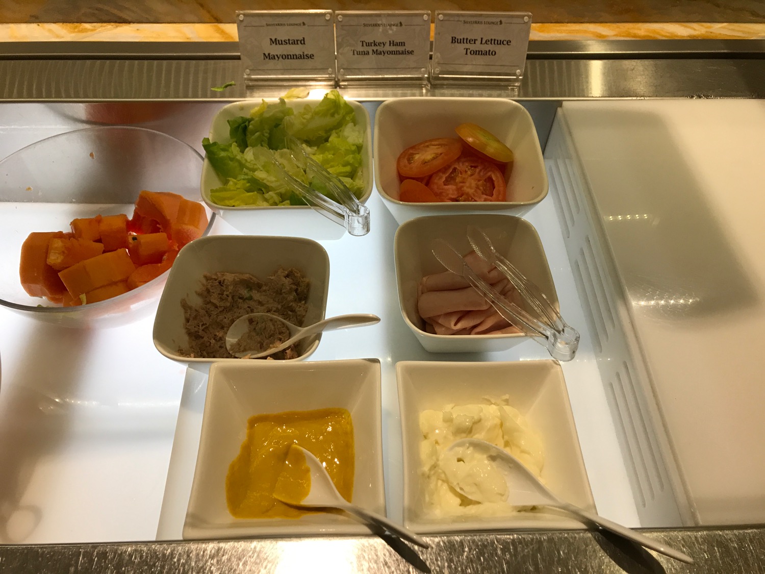 a salad bar with different types of food