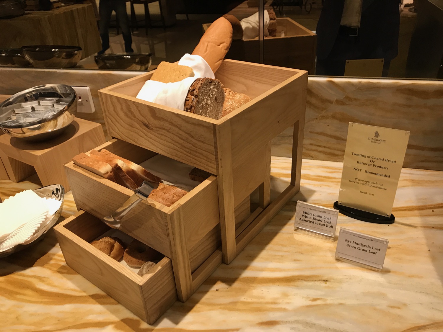 a wooden box with bread in it