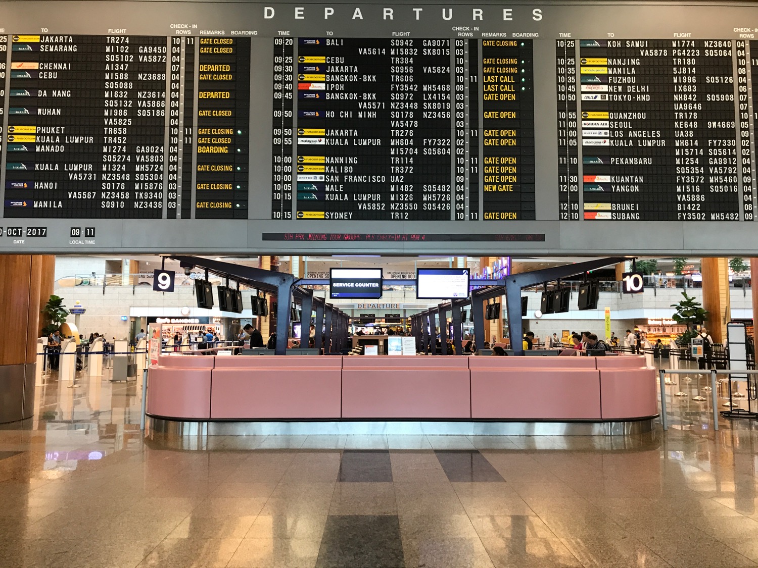 a large display board in a airport