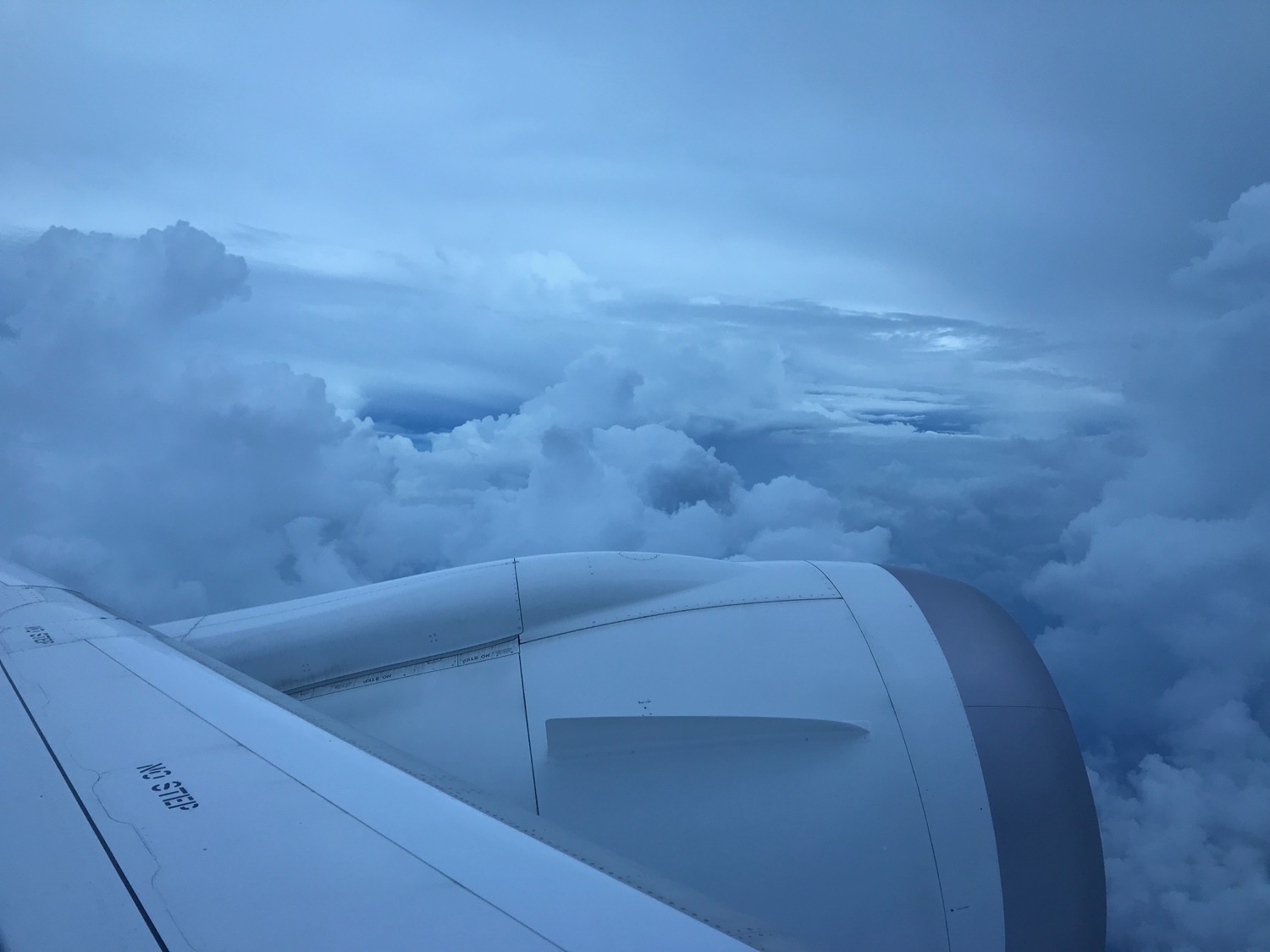 an airplane wing and clouds
