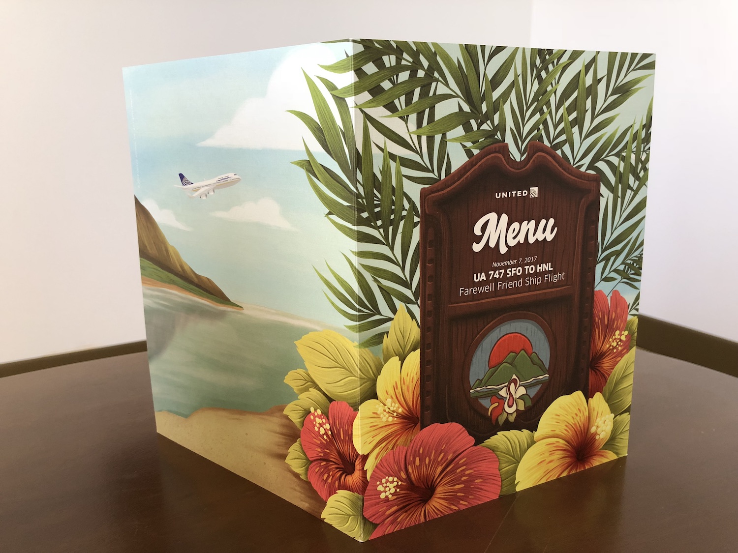 a menu box with flowers and leaves on it