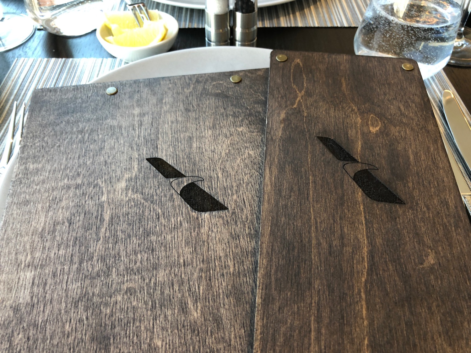 a wooden table with knife engraved on it