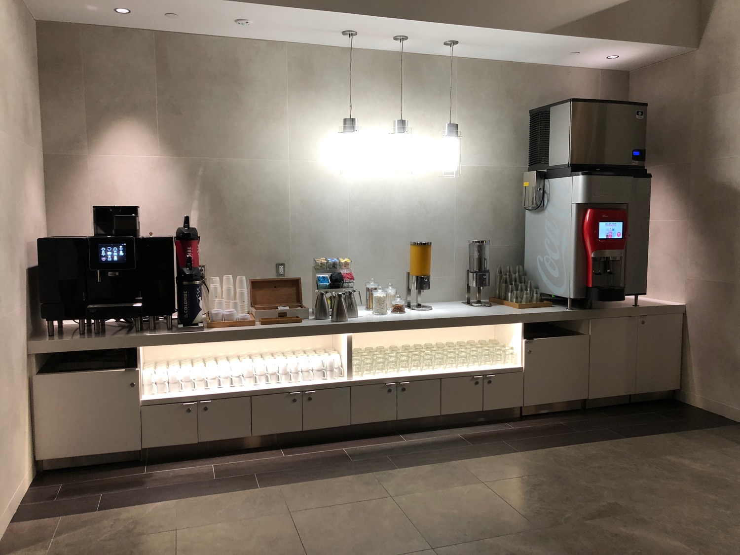 a counter with drinks and beverages on it