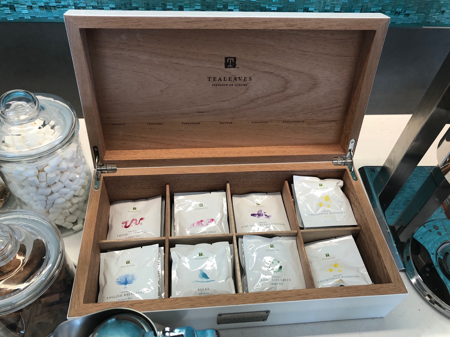 a wooden box with tea bags in it