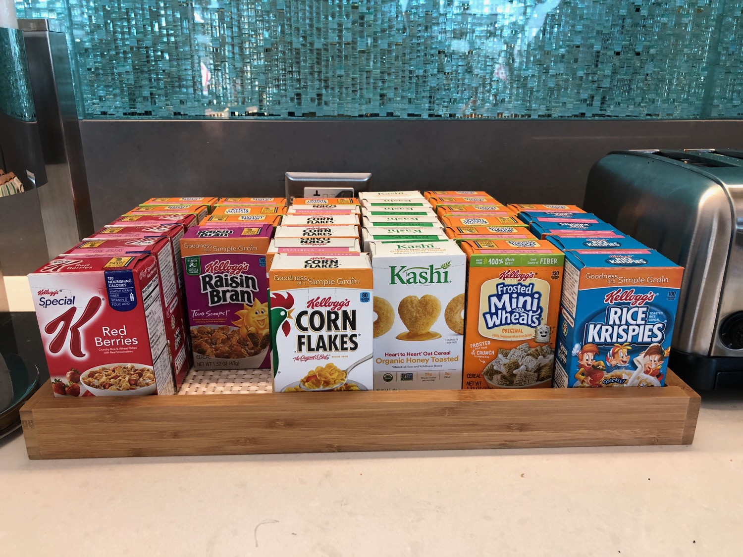 a group of cereal boxes on a wooden shelf