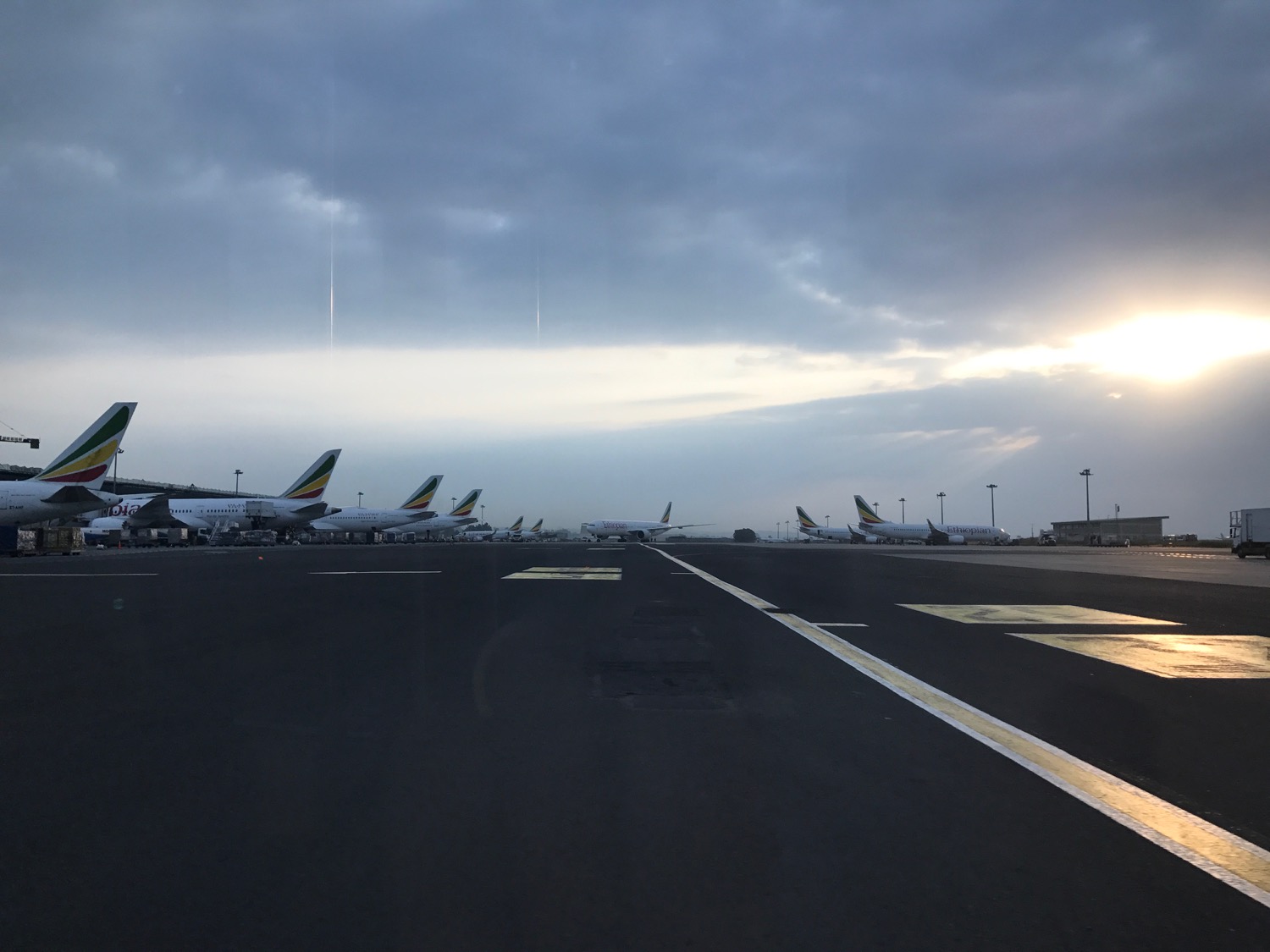 a row of airplanes on a runway
