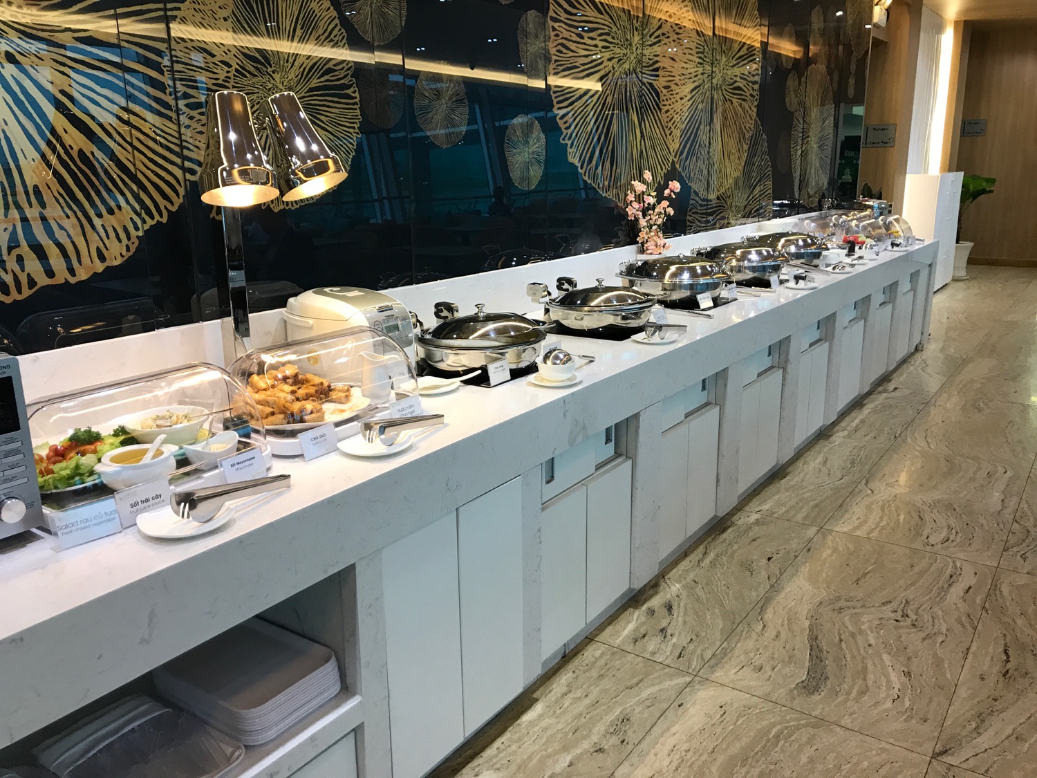 a buffet line with food on it