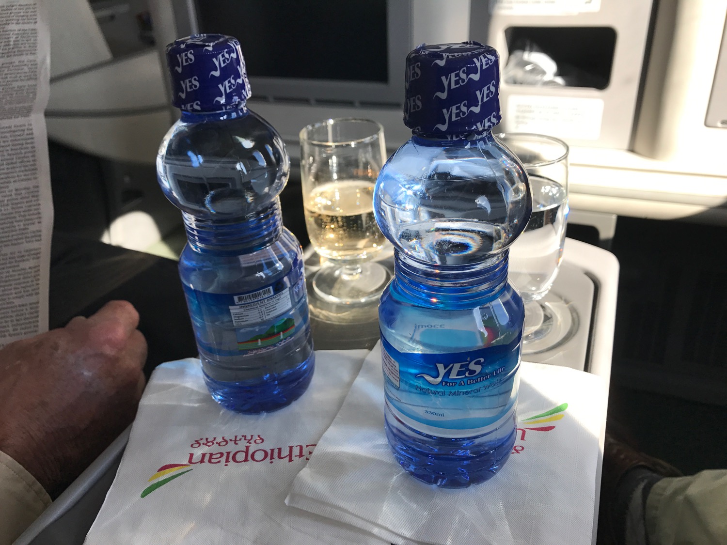 two bottles of water on a tray