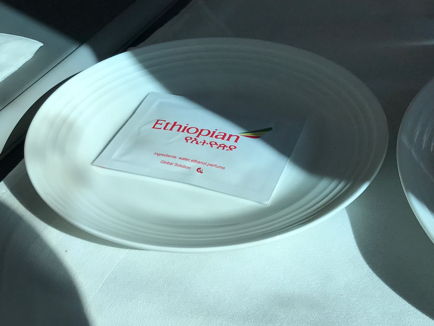 a white plate with a packet on it