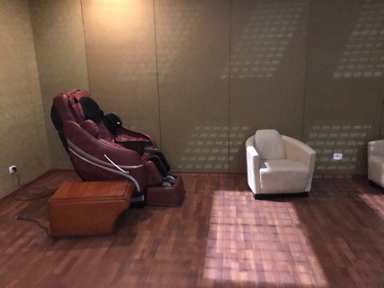 a massage chair and a chair in a room