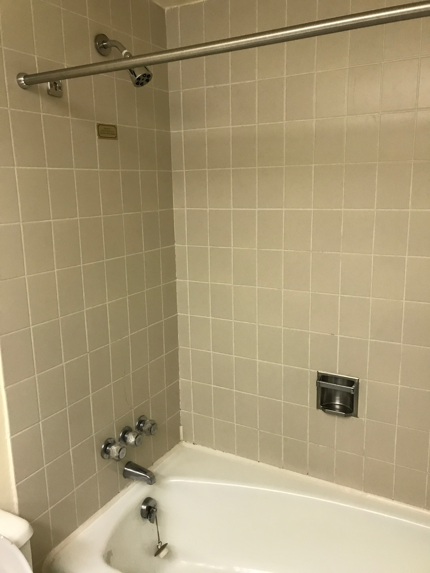 a shower and tub in a bathroom