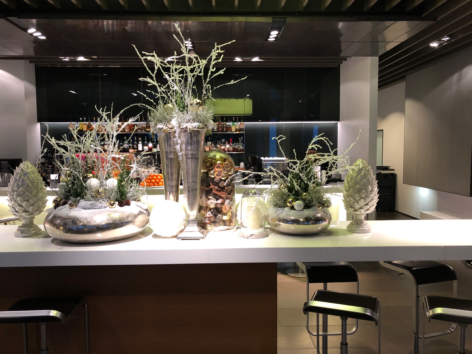 a table with vases and plants on it