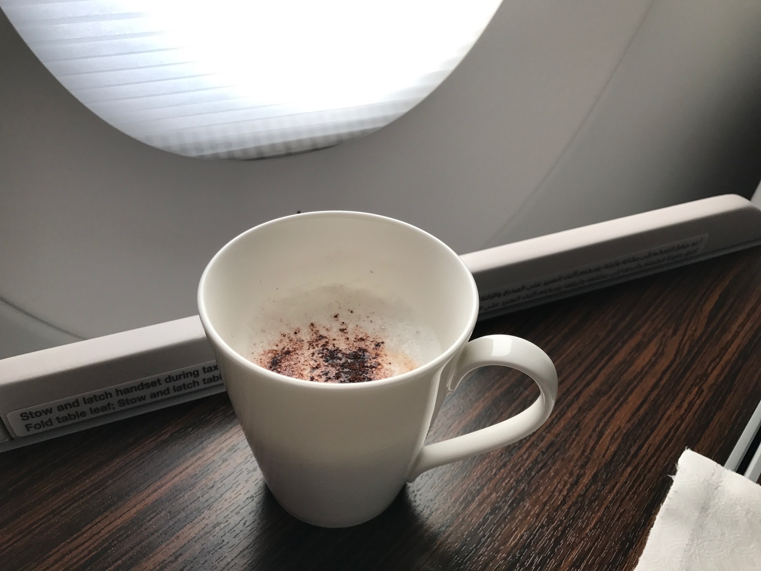a white cup with brown powder in it