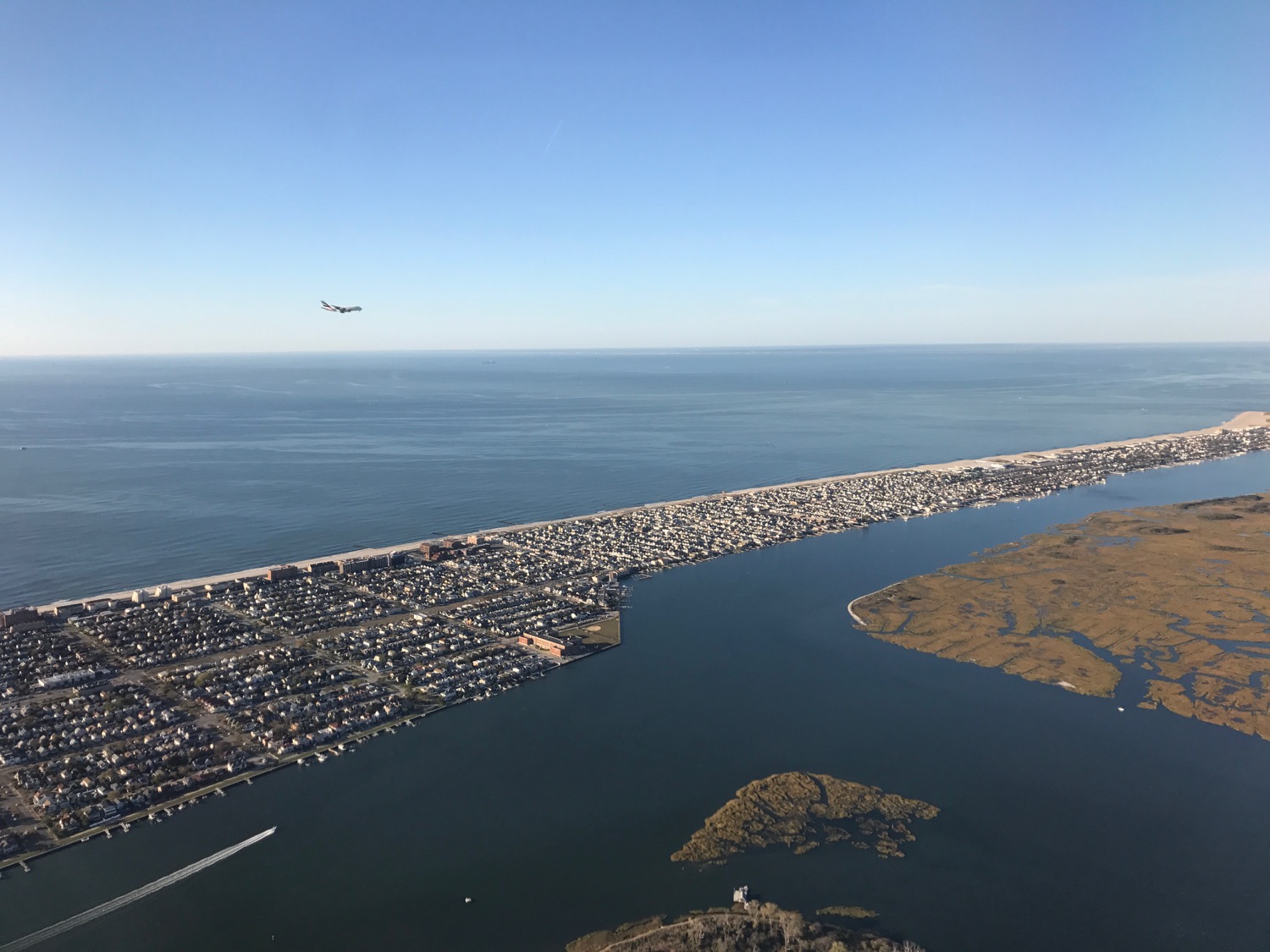 an airplane flying over a body of water