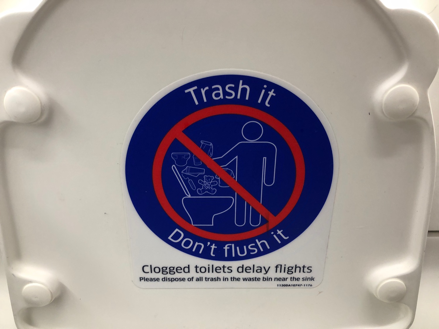 a sign on a toilet