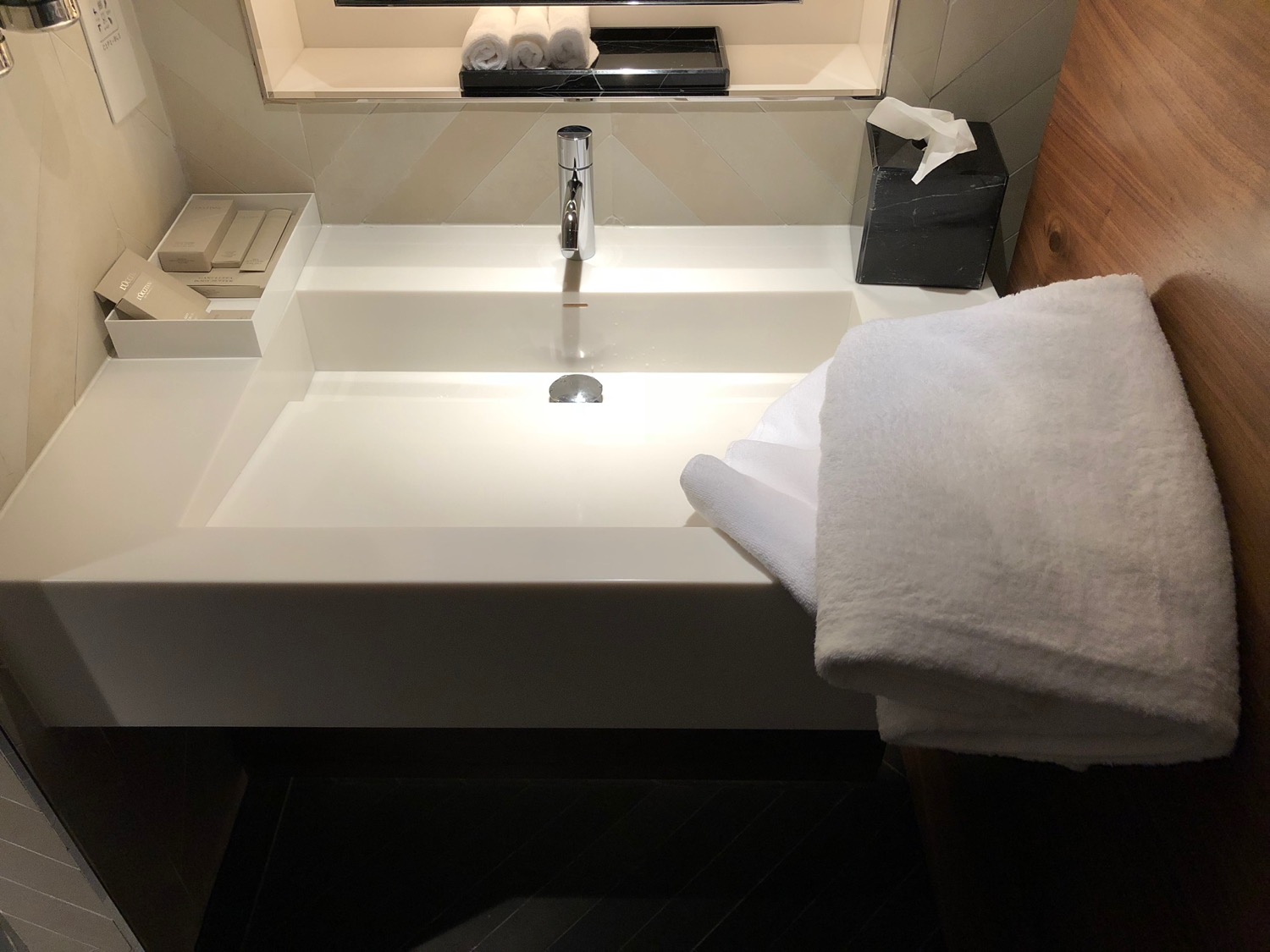 a white towel on a sink