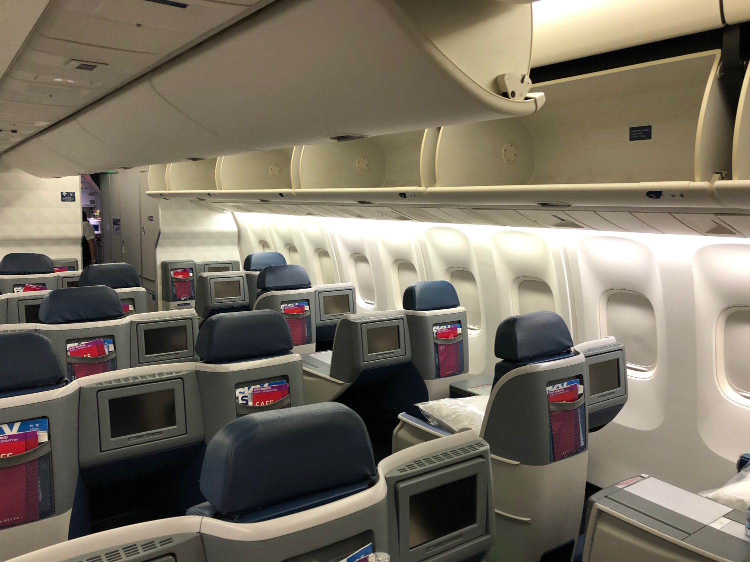 an airplane with seats and monitors